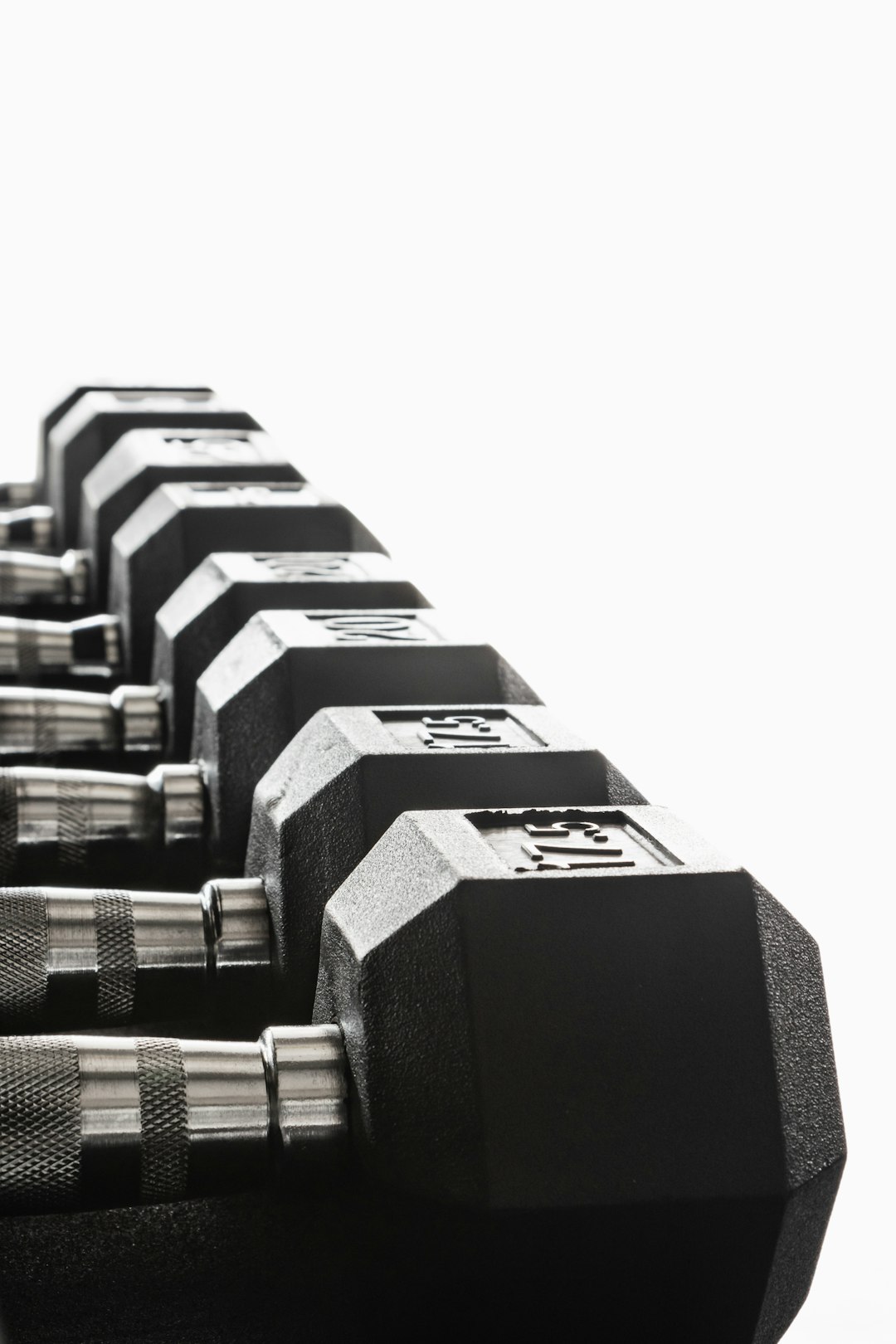 black-and-silver-dumbbells-on-white-background-0zkj1esh9dy
